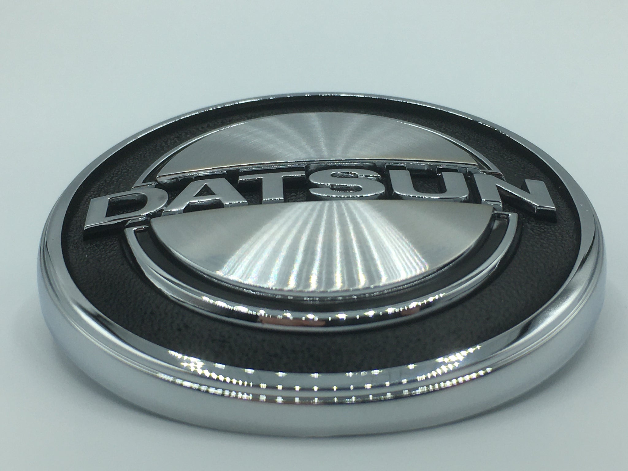 Genuine OEM Nissan Front Hood Emblem – Fits 1970-74 Datsun 240Z (65810-E4601)